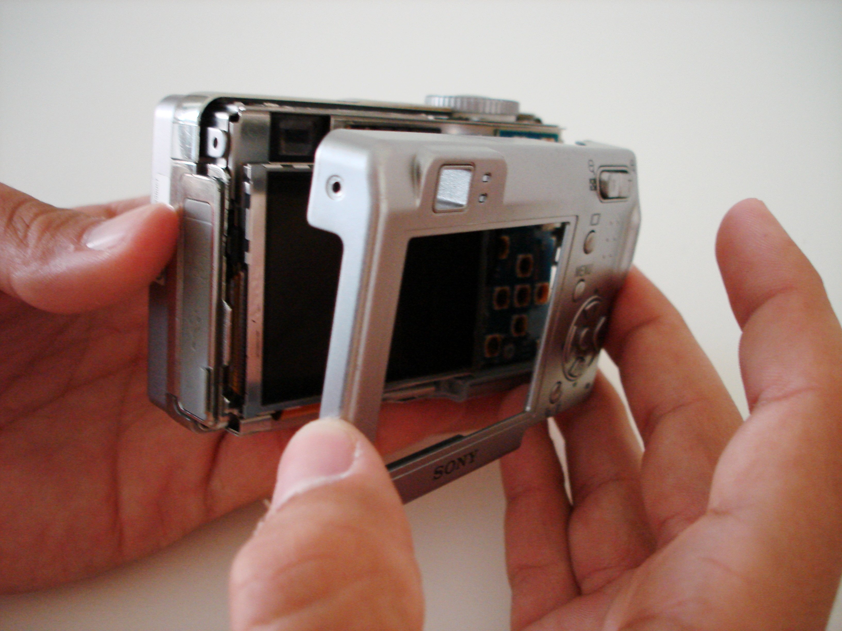 Disassembling Sony Cyber-shot DSC-W5 Back Cover - iFixit Repair Guide