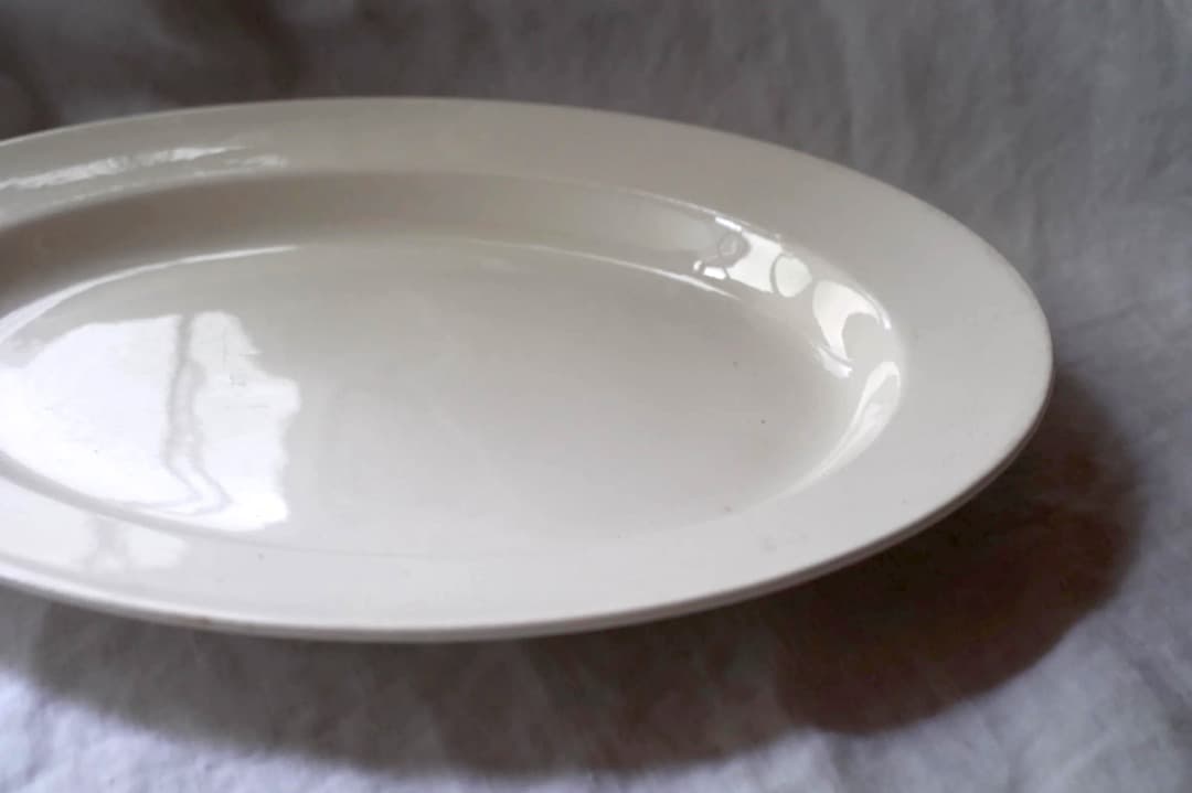 オランダアンティーク｜ペトルス・レグー社のオーバルプレート ペトルス・レグー社(マーストリヒト) グリザイユプレート（直径24cm